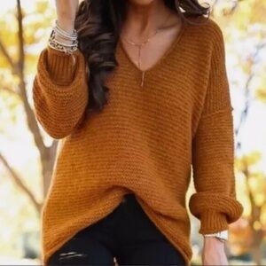 Free People Women's V-Neck Sweater in Rust